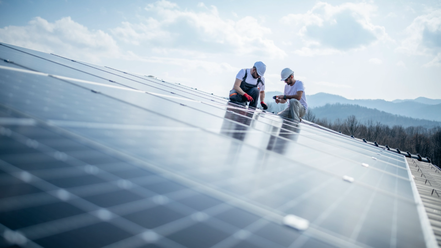 Two engineers installing solar panels Two engineers installing solar panels